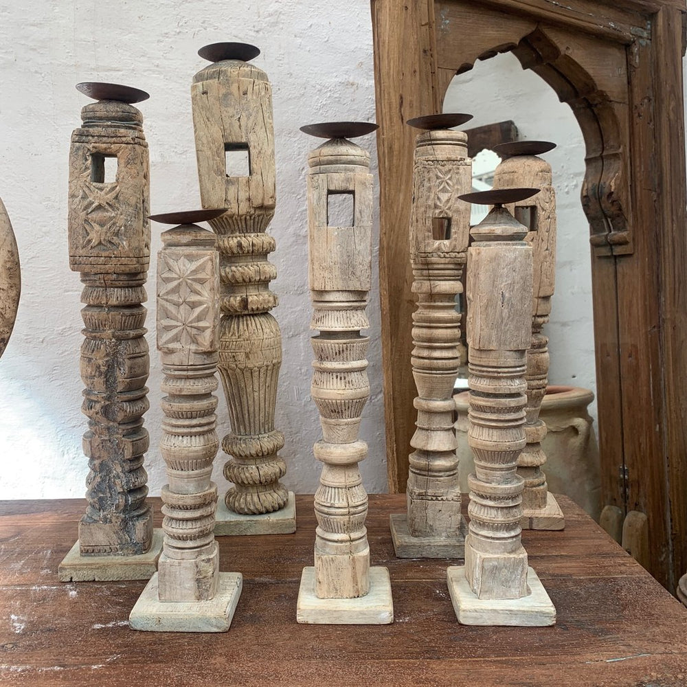 
                  
                    Tall carved candle stands
                  
                